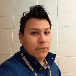 Meet our staff, Pablo Pablo M. of Noble Knight Games, wearing a blue shirt and Dr. Who Police Box lanyard